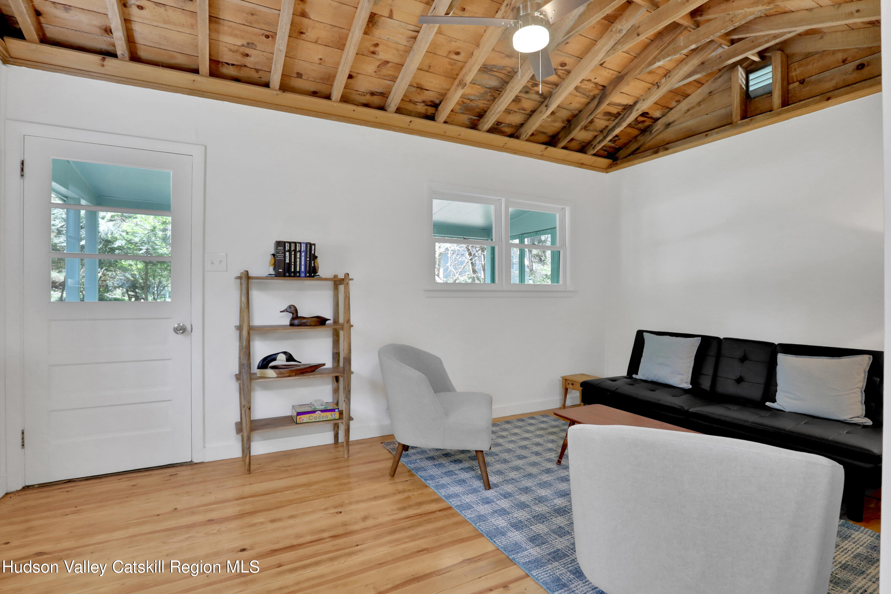 26 Beach Road Lumberland, NY 12737 - Photo 7 of 22 a living room with furniture and a wooden floor