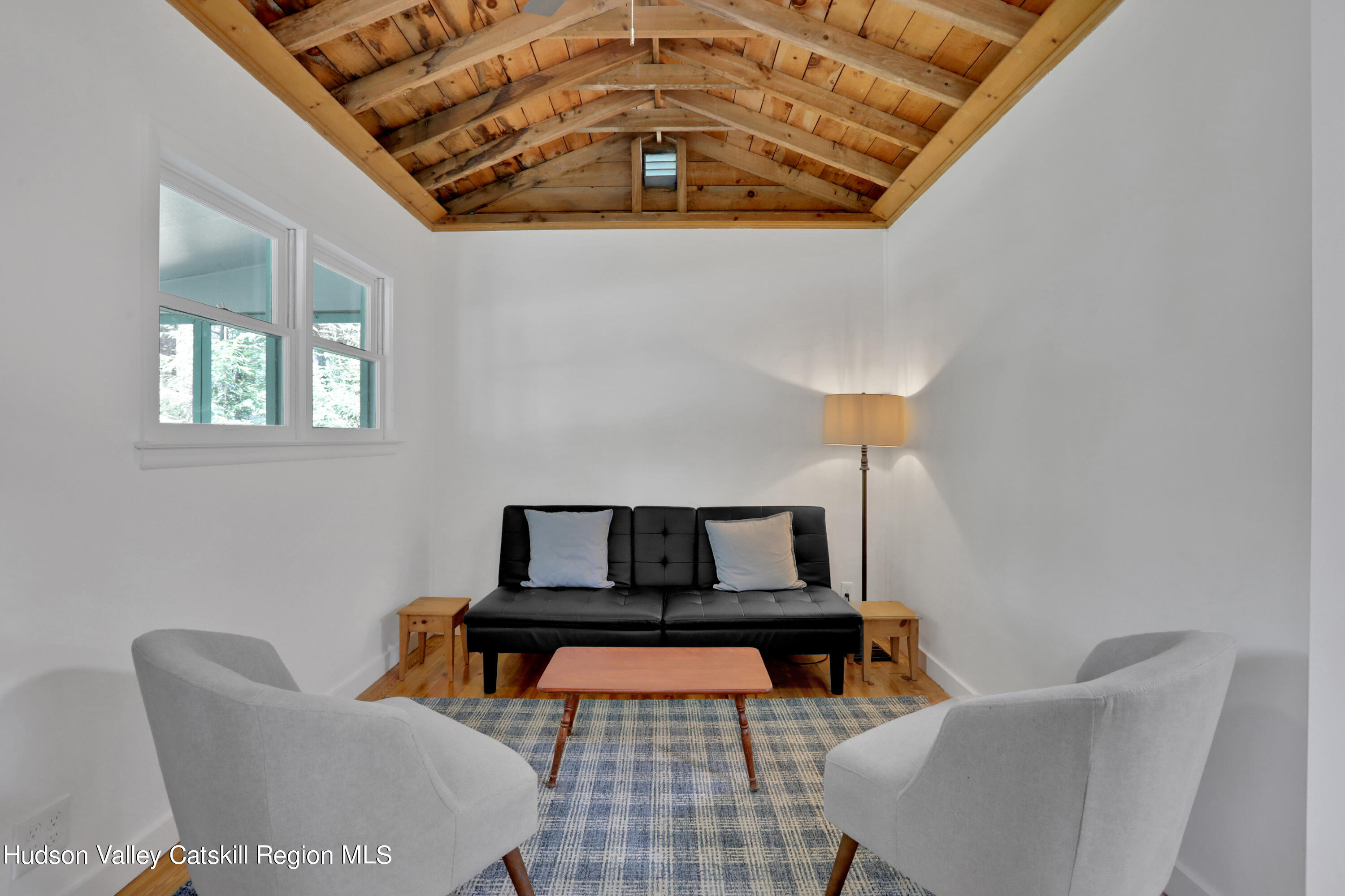 26 Beach Road Lumberland, NY 12737 - Photo 8 of 22 a living room with furniture and a lamp