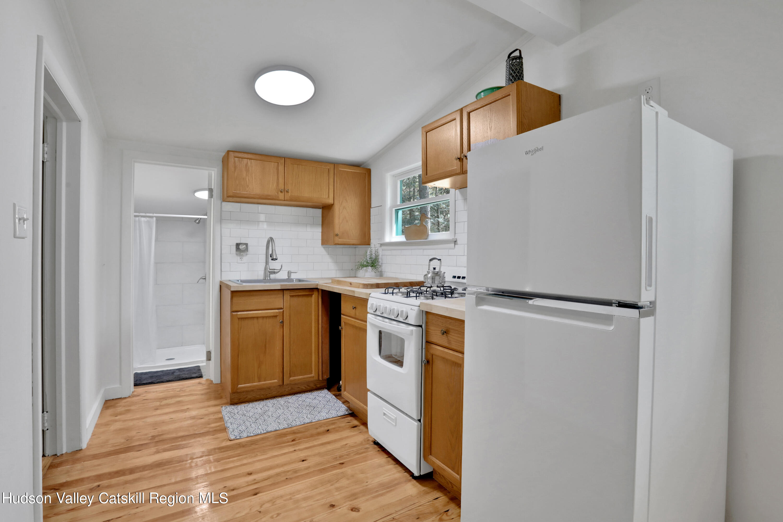 26 Beach Road Lumberland, NY 12737 - Photo 10 of 22 a kitchen with a refrigerator sink stove and cabinets