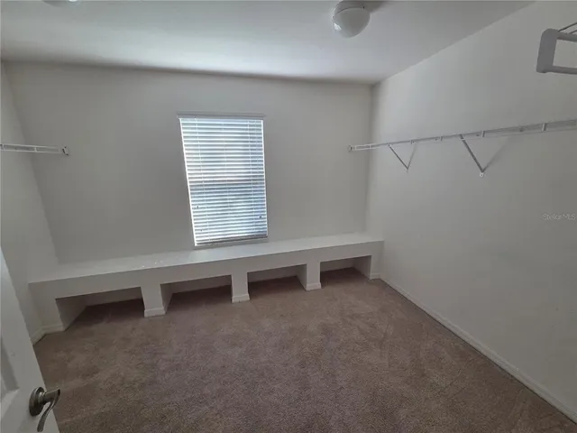 a bathroom with a shower and a mirror
