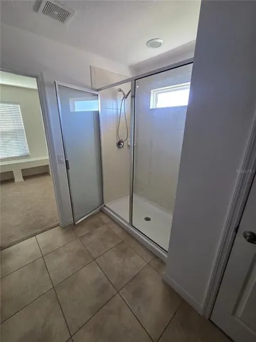 a kitchen with a refrigerator and a sink