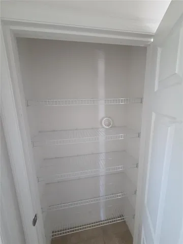 a kitchen with a refrigerator and a sink