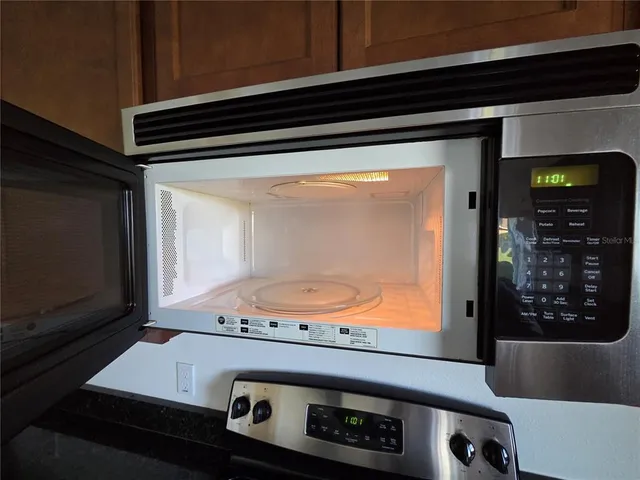 a view of an empty room and a window