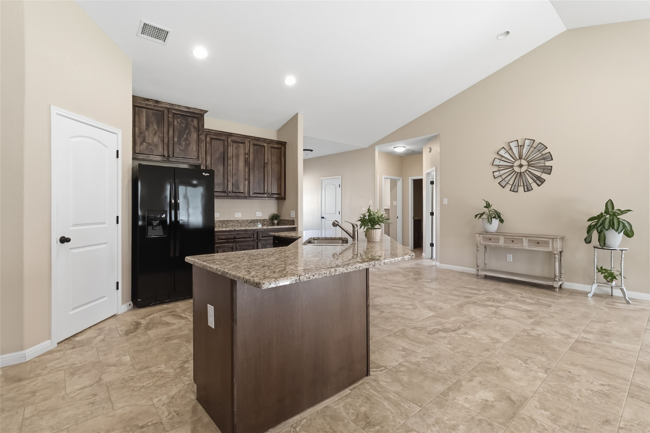 285 Hummingbird Way Martindale, TX 78655 - Photo 10 of 40 a kitchen with stainless steel appliances granite countertop a refrigerator oven a sink and dishwasher