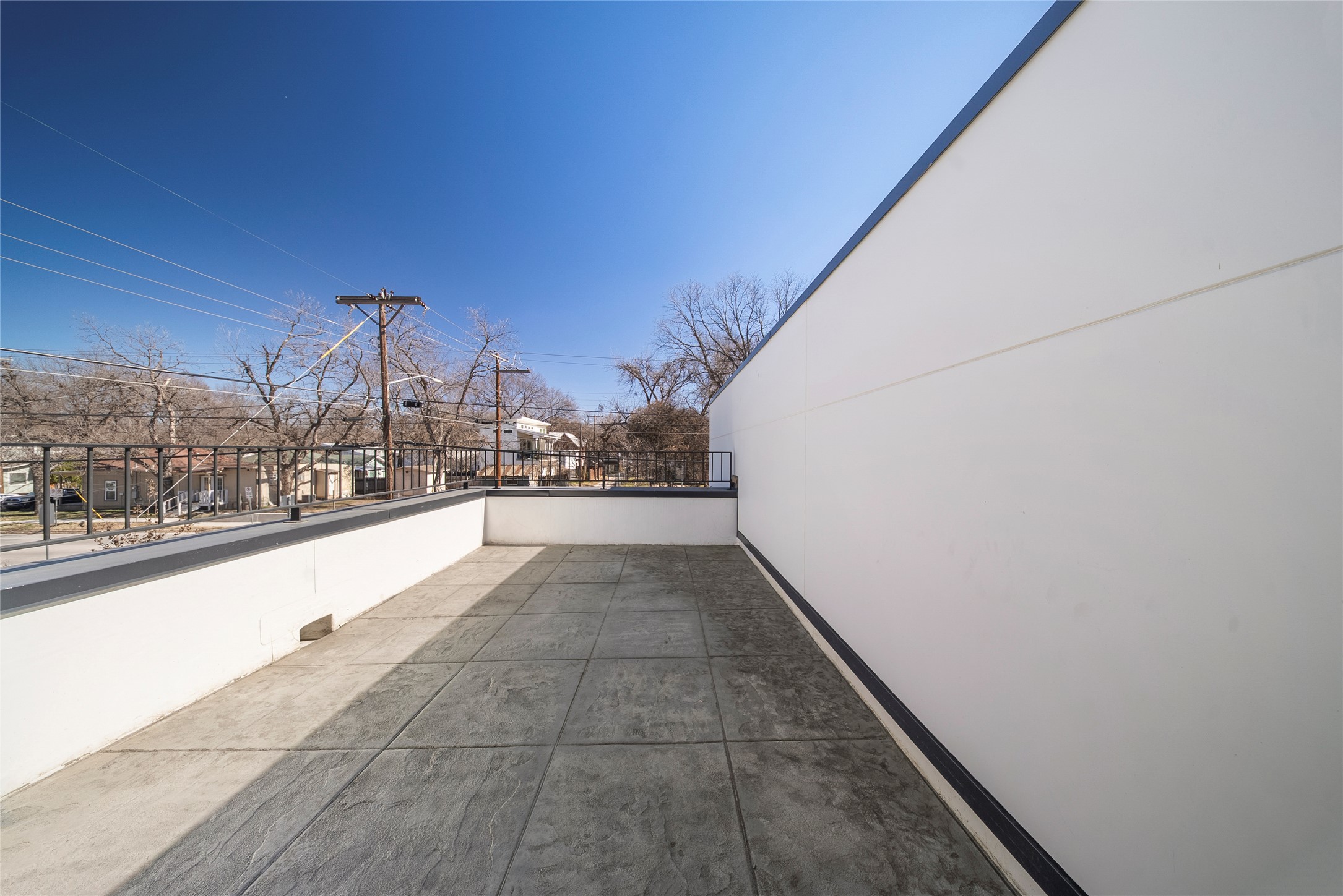 44 Chicon Street, Unit 1 Austin, TX 78702 - Photo 15 of 29 balcony off of primary suite with downtown views during the winter and early spring