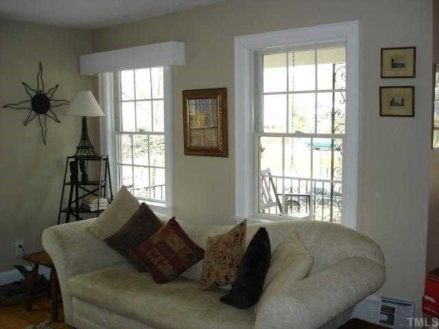 1507 Cherokee Drive Raleigh, NC 27608 - Photo 11 of 12 Light and bright front living room with fireplace