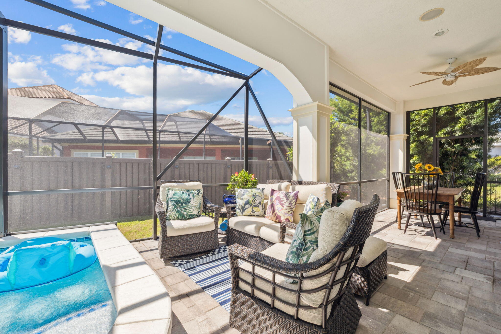 4732 Papaya Park Destin, FL 32541 - Photo 14 of 50 a living room with furniture a ceiling fan and a floor to ceiling window
