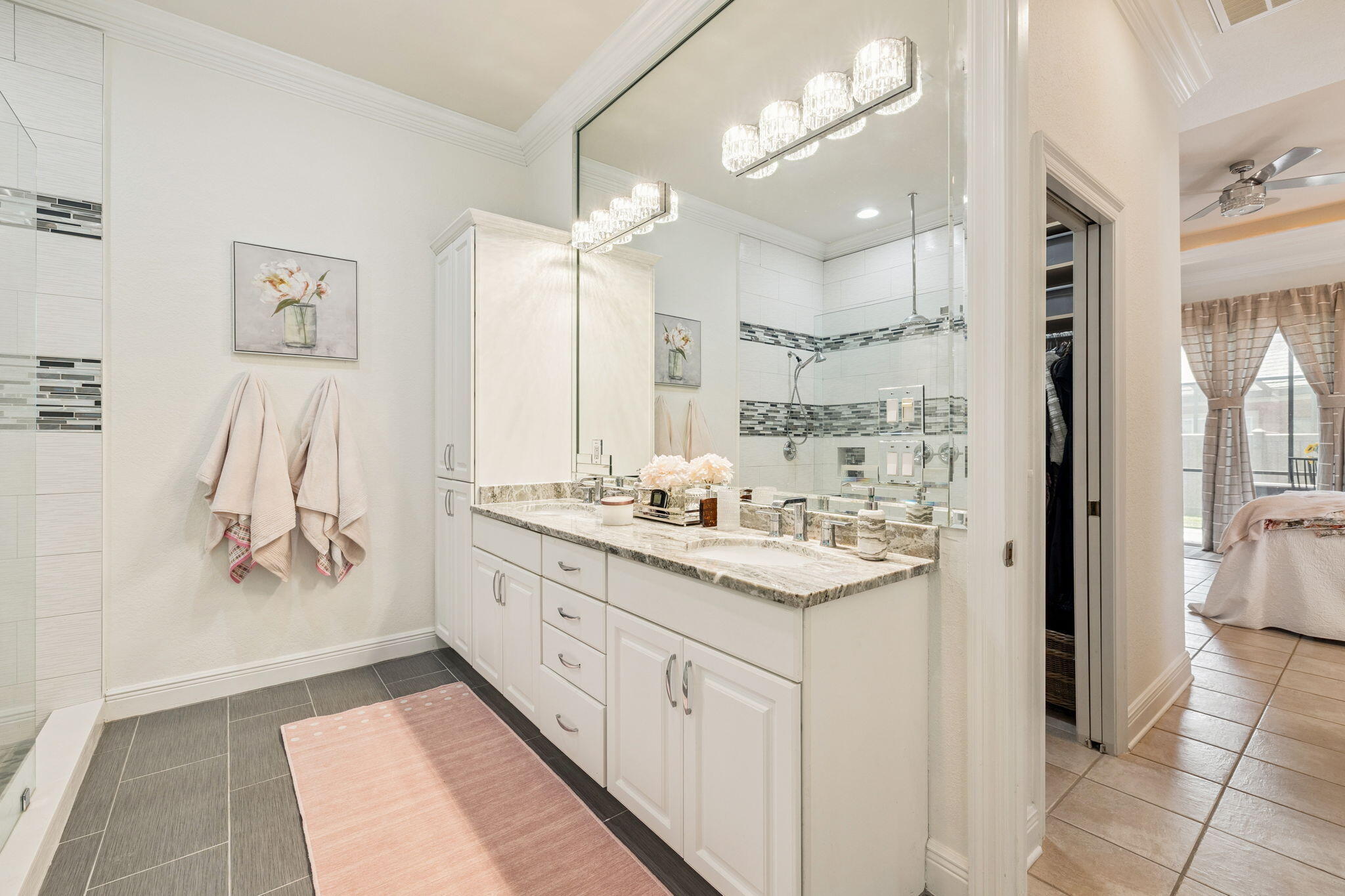 4732 Papaya Park Destin, FL 32541 - Photo 21 of 50 a bathroom with a double vanity sink a mirror and a shower