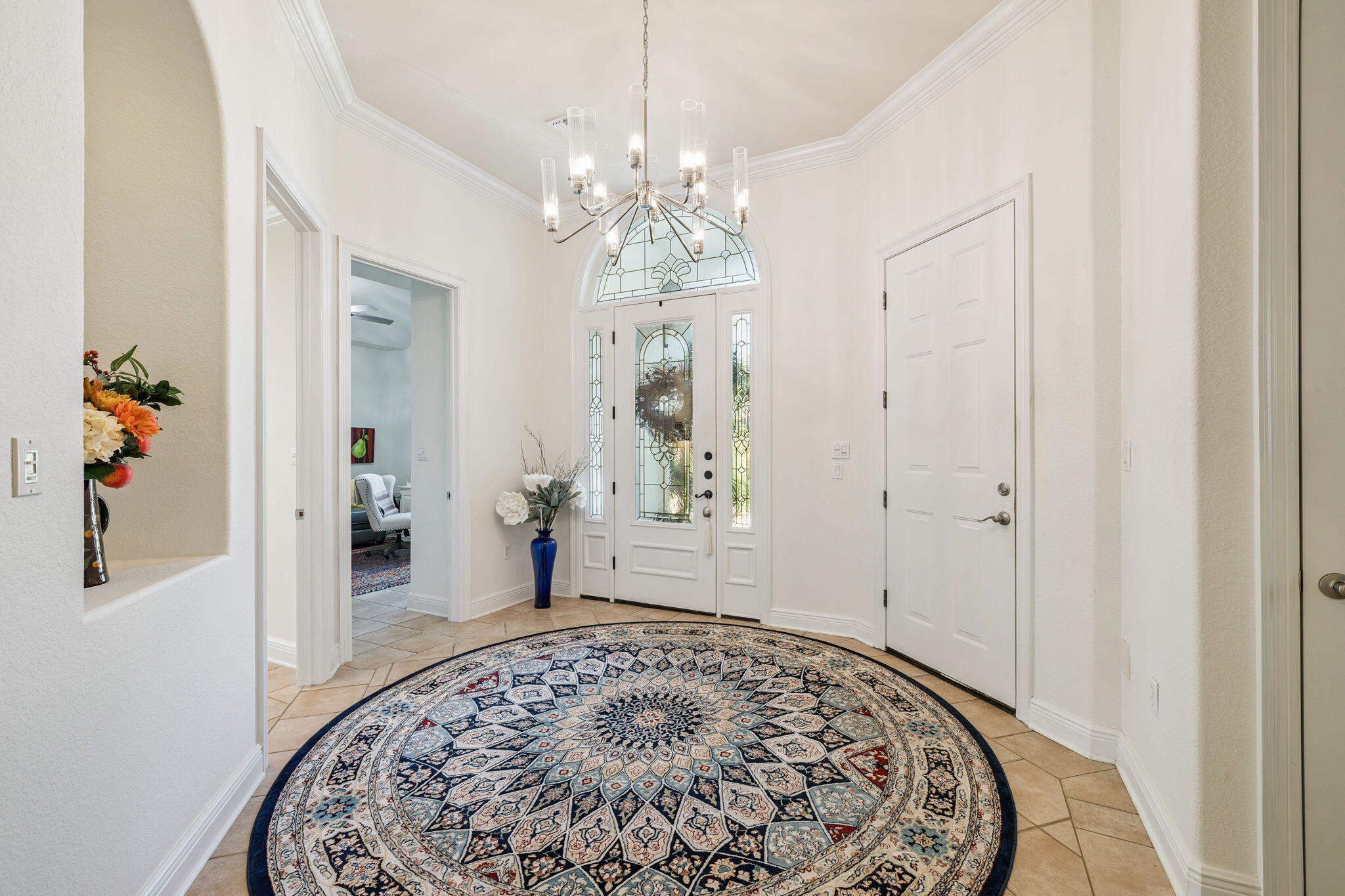 4732 Papaya Park Destin, FL 32541 - Photo 23 of 50 a bedroom with a bed and a chandelier