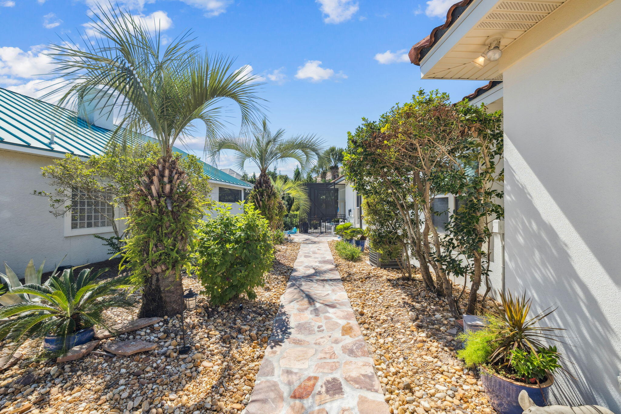 4732 Papaya Park Destin, FL 32541 - Photo 33 of 50 a vase of flowers sitting on a sidewalk