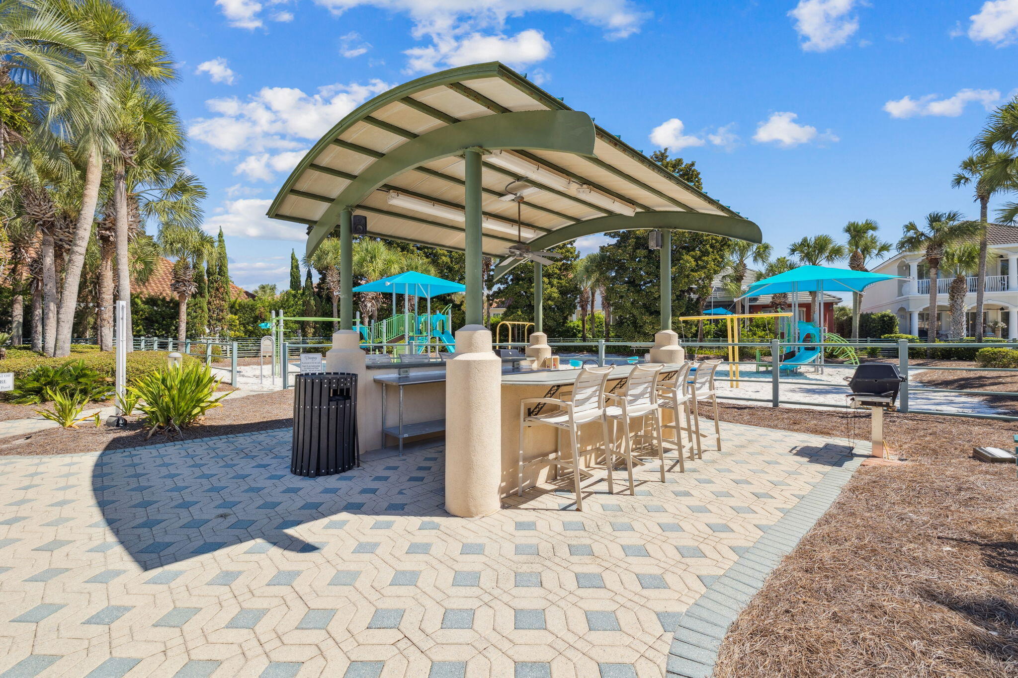 4732 Papaya Park Destin, FL 32541 - Photo 46 of 50 a view of a patio with a table and chairs under an umbrella