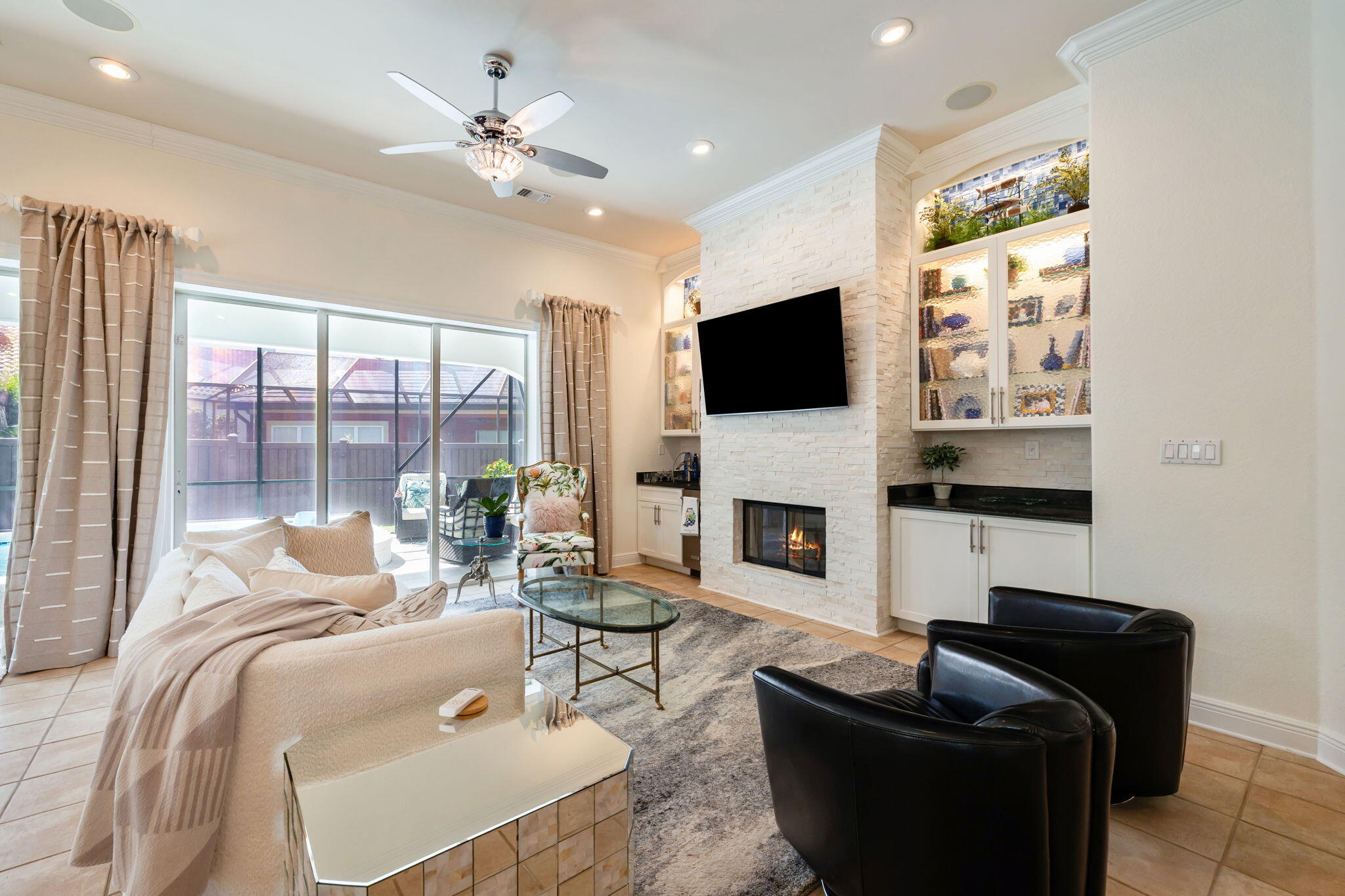 4732 Papaya Park Destin, FL 32541 - Photo 9 of 50 a living room with furniture a fireplace and a flat screen tv