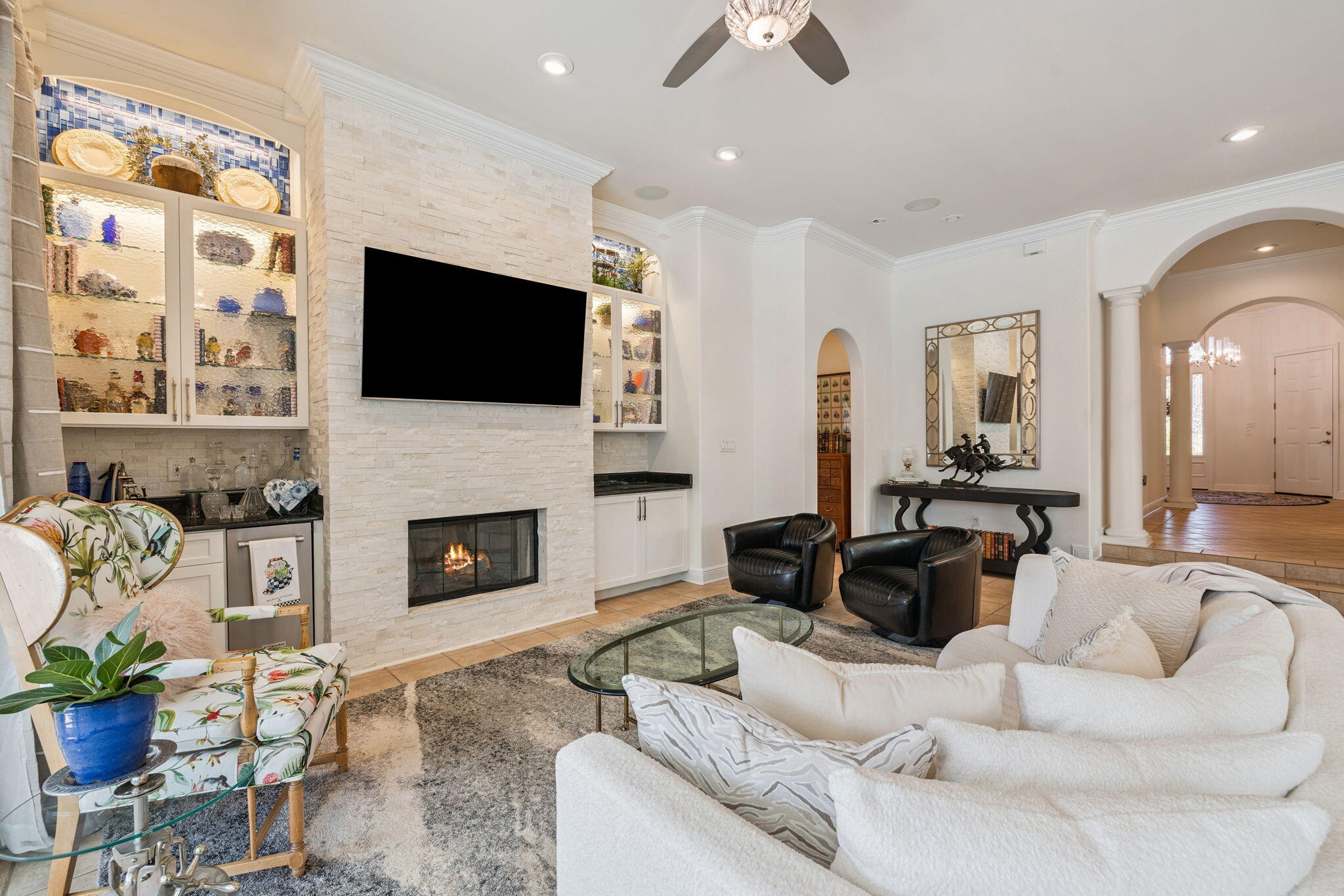 4732 Papaya Park Destin, FL 32541 - Photo 10 of 50 a living room with furniture a flat screen tv and a fireplace