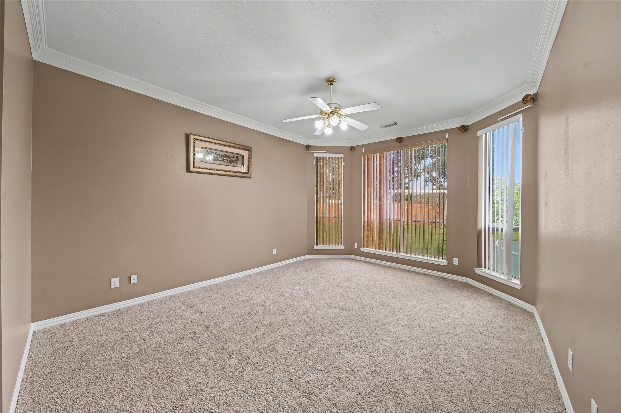 5403 Emerald Pointe Lane Sugar Land, TX 77479 - Photo 15 of 50 an empty room with windows and chandelier