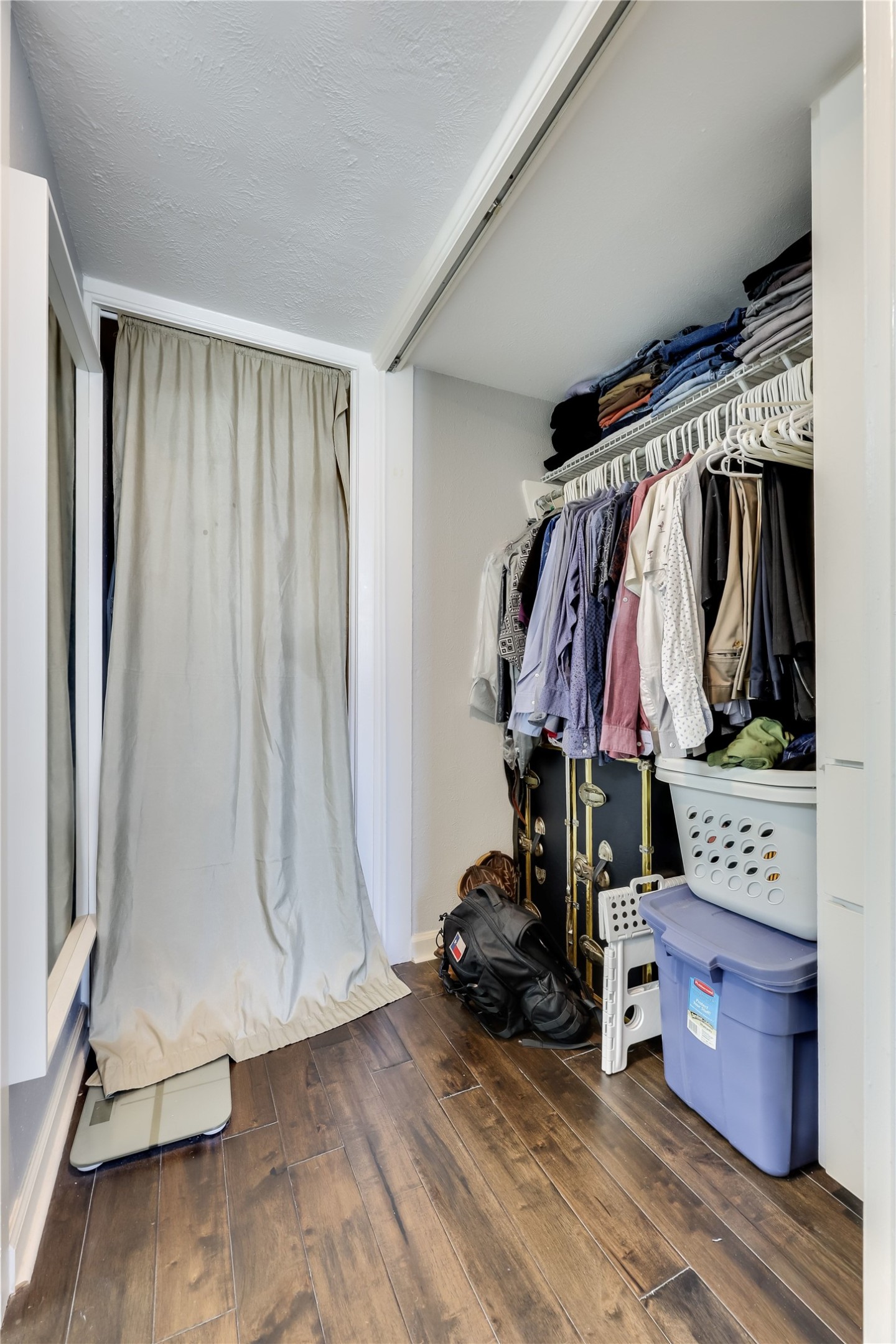 1800 Lavaca Street, Unit A711 Austin, TX 78701 - Photo 12 of 18 a view of walk in closet with clothes and shoes