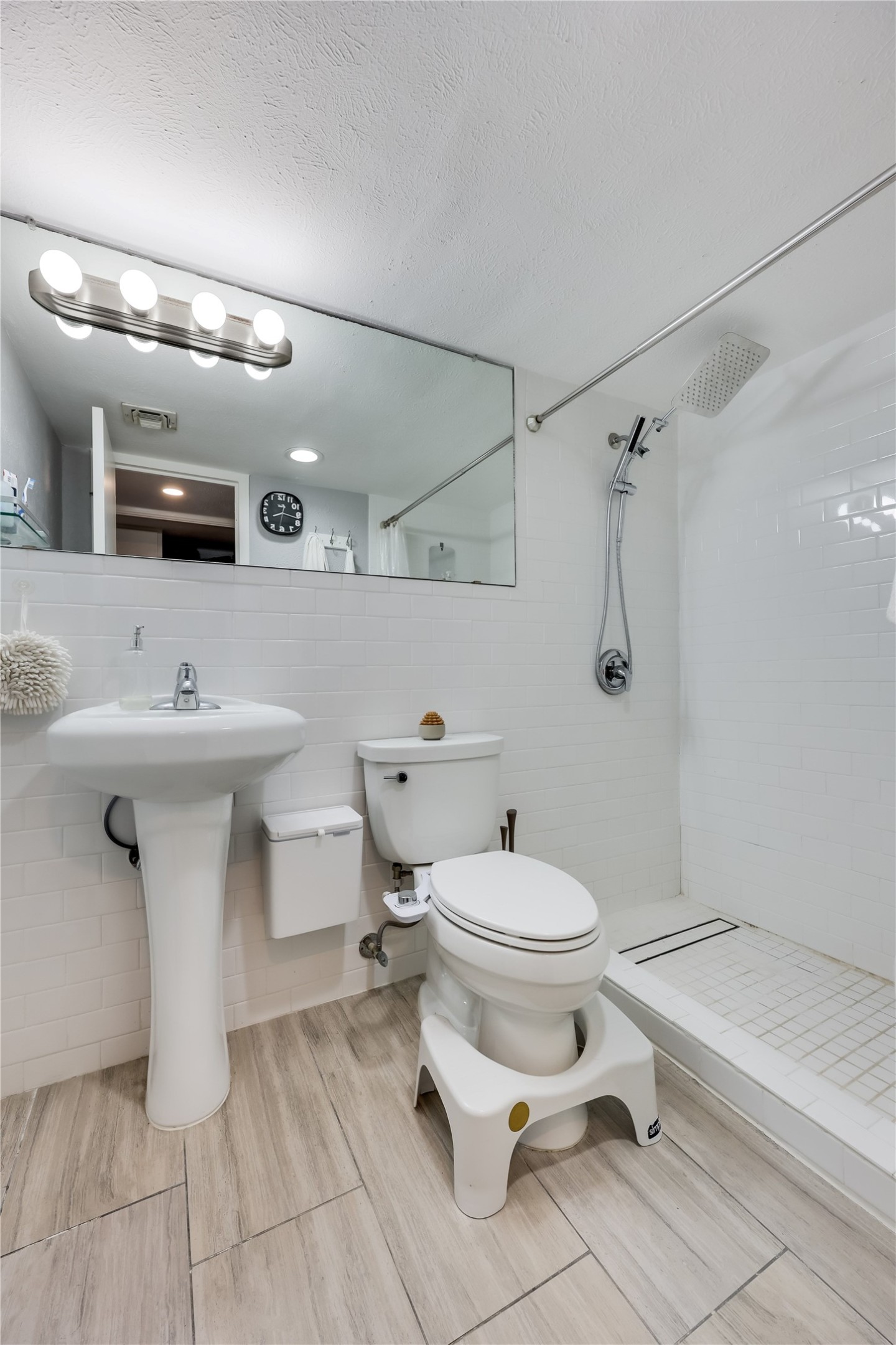 1800 Lavaca Street, Unit A711 Austin, TX 78701 - Photo 13 of 18 a bathroom with a sink toilet and shower