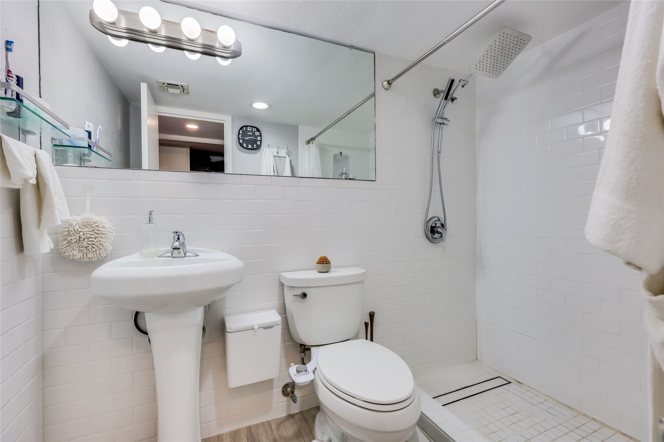 1800 Lavaca Street, Unit A711 Austin, TX 78701 - Photo 14 of 18 a bathroom with a sink a toilet and shower