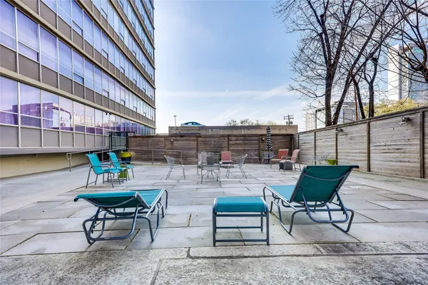 a view of a chairs and table in the patio