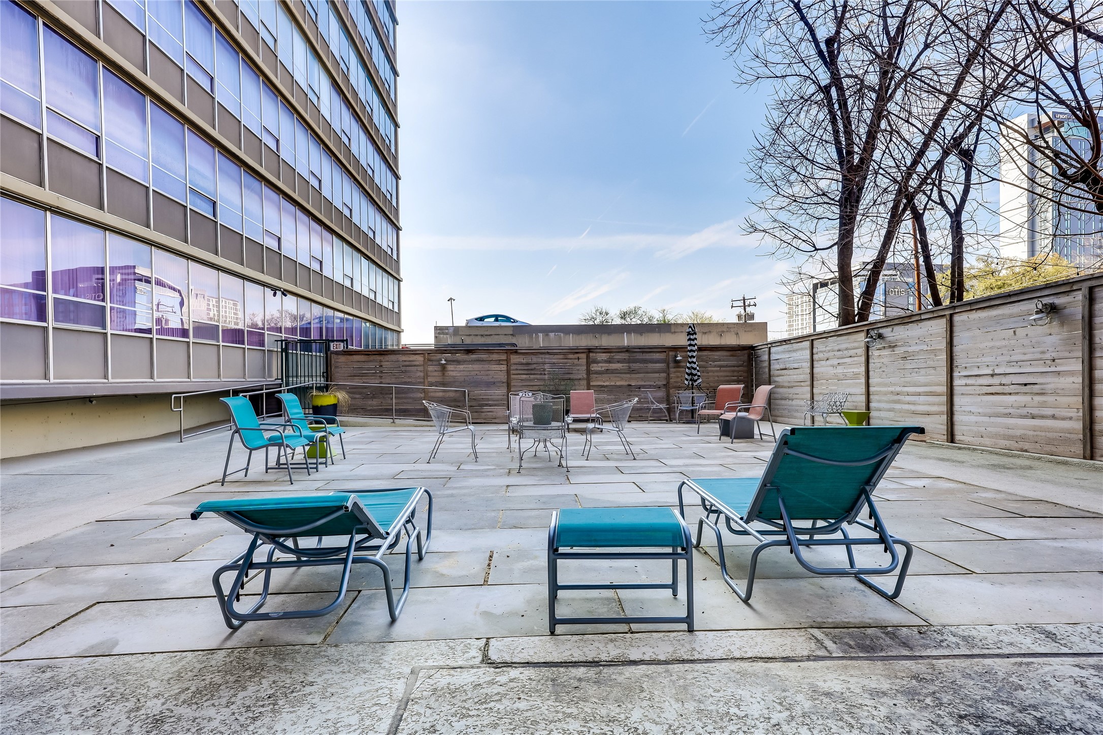 1800 Lavaca Street, Unit A711 Austin, TX 78701 - Photo 17 of 18 a view of a chairs and table in the patio