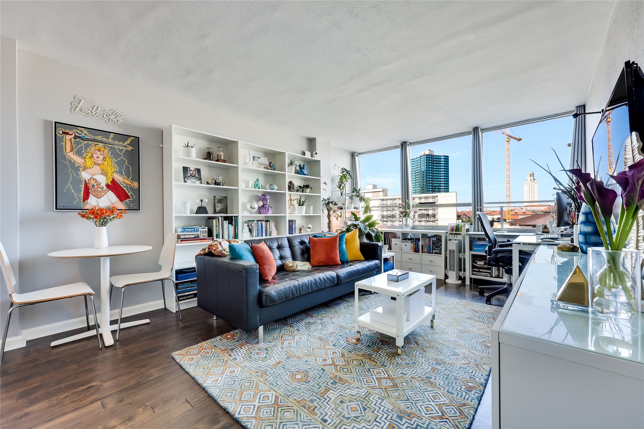 1800 Lavaca Street, Unit A711 Austin, TX 78701 - Photo 2 of 18 a living room with furniture and a flat screen tv