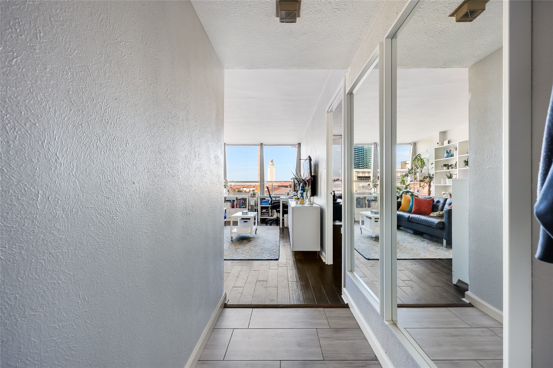 1800 Lavaca Street, Unit A711 Austin, TX 78701 - Photo 3 of 18 a view of a hallway with living room and furniture