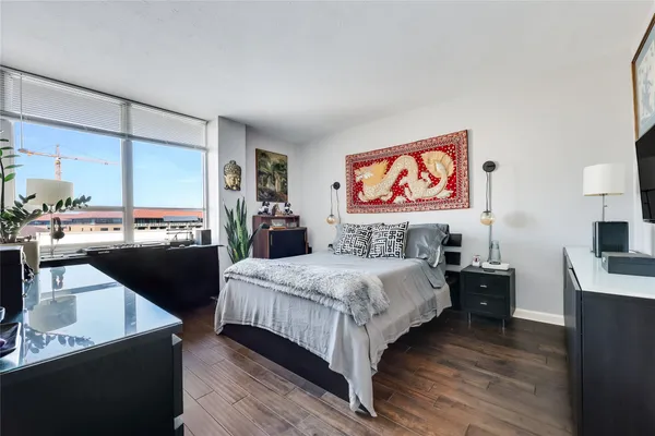 a bedroom with a bed and dresser