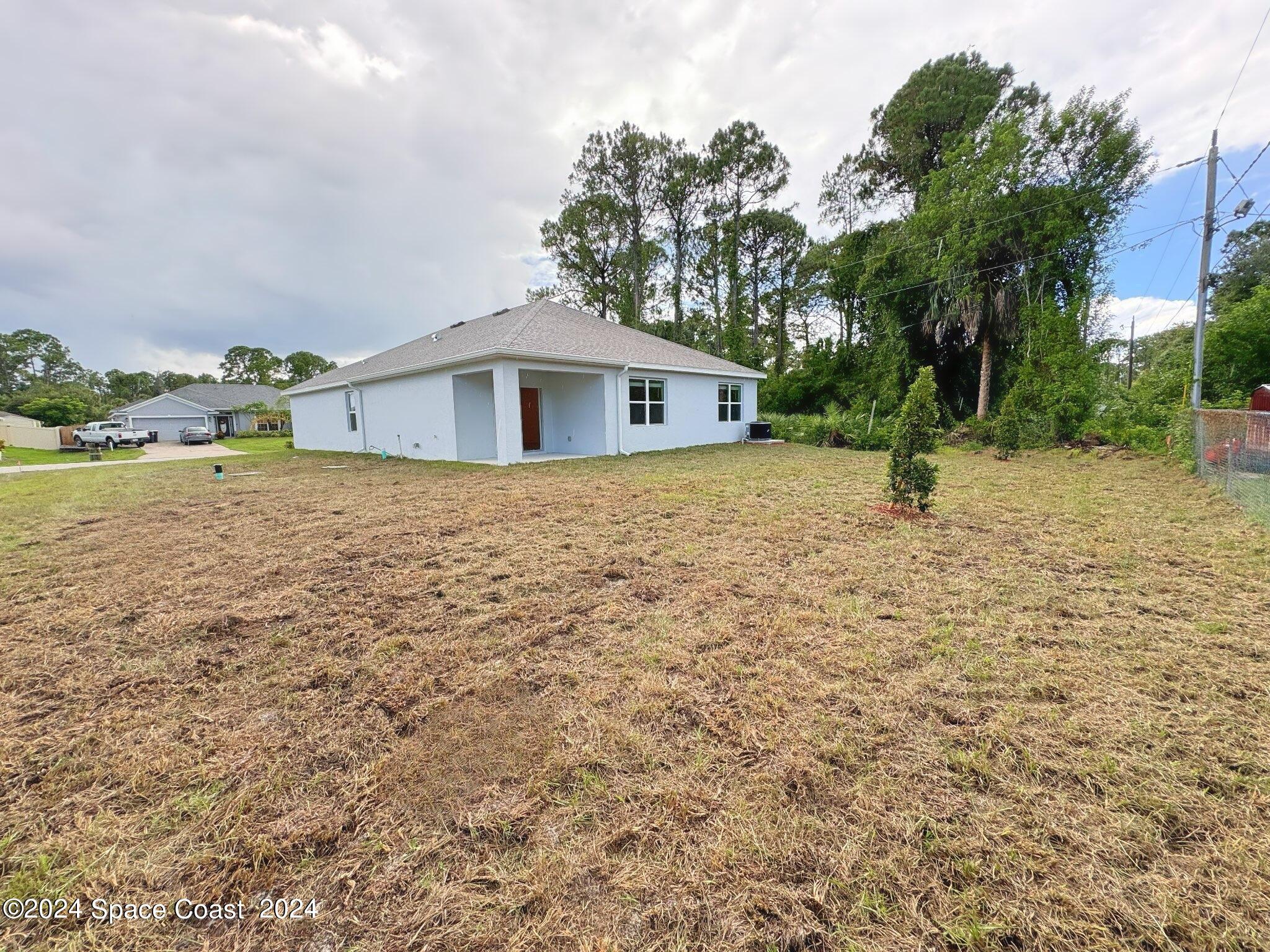 435 Oakleaf Street Southwest Palm Bay, FL 32908 - Photo 19 of 44 18. 435 Oakleaf - Backyard from Right
