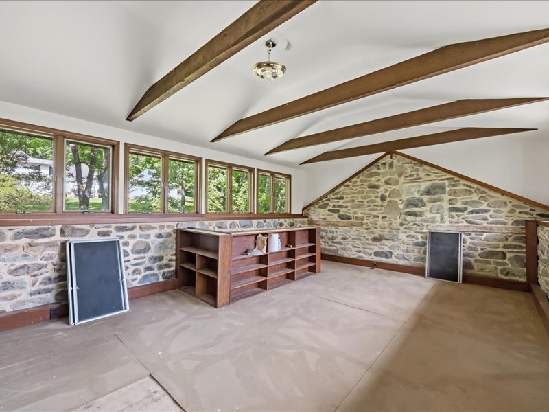 1168 Mt Pleasant Road Bangor, PA 18013 - Photo 99 of 100 Exposed ceiling beams and rustic stone walls define this unique, light-filled attic bonus space.