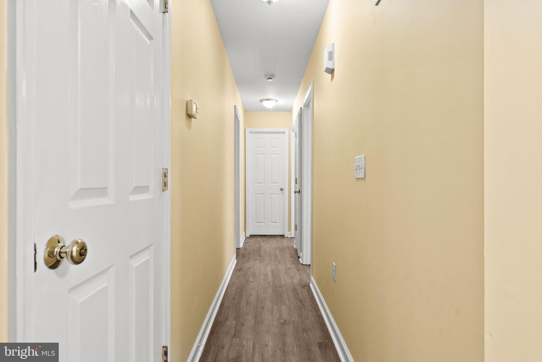 20065 Crooked Run Road Culpeper, VA 22701 - Photo 21 of 62 a view of a hallway with wooden floor