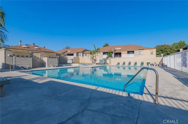 a view of a porch with chairs and backyard