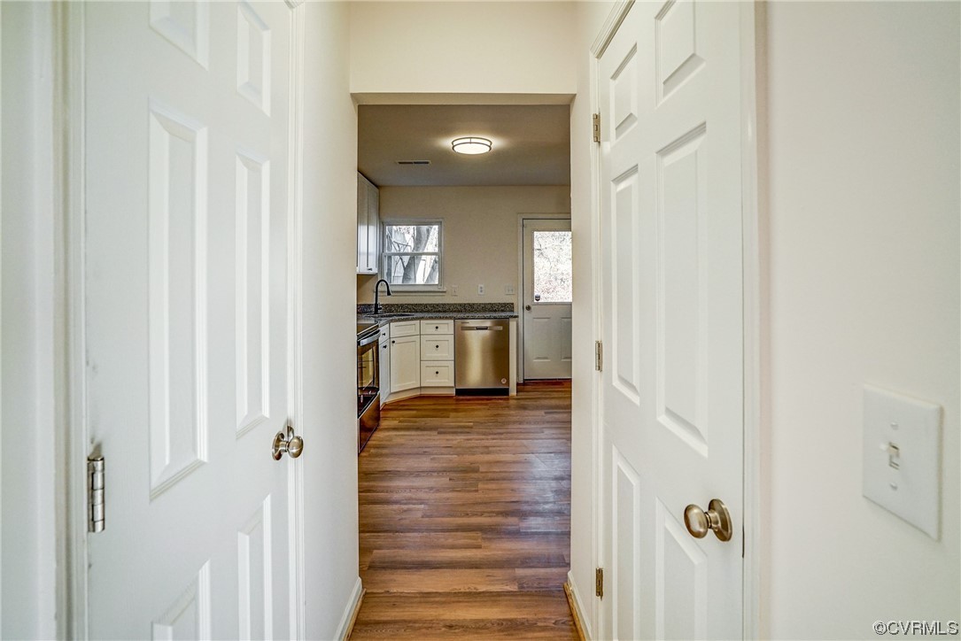 603 Bailey Road Charlottesville, VA 22903 - Photo 16 of 37 a view of a hallway with wooden floor and staircase