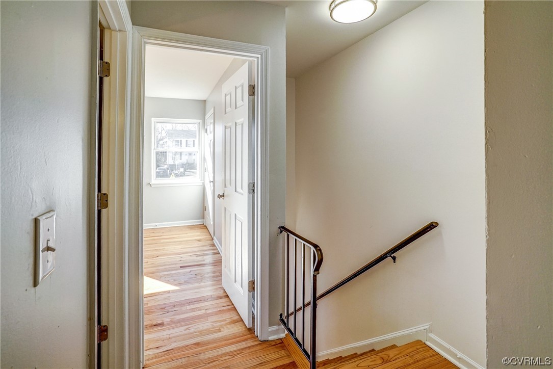 603 Bailey Road Charlottesville, VA 22903 - Photo 23 of 37 a view of a hallway with wooden floor and staircase