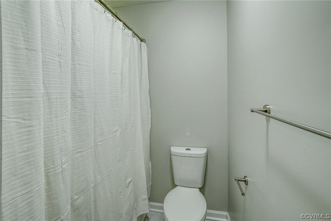 603 Bailey Road Charlottesville, VA 22903 - Photo 29 of 37 a white toilet sitting next to a white wall