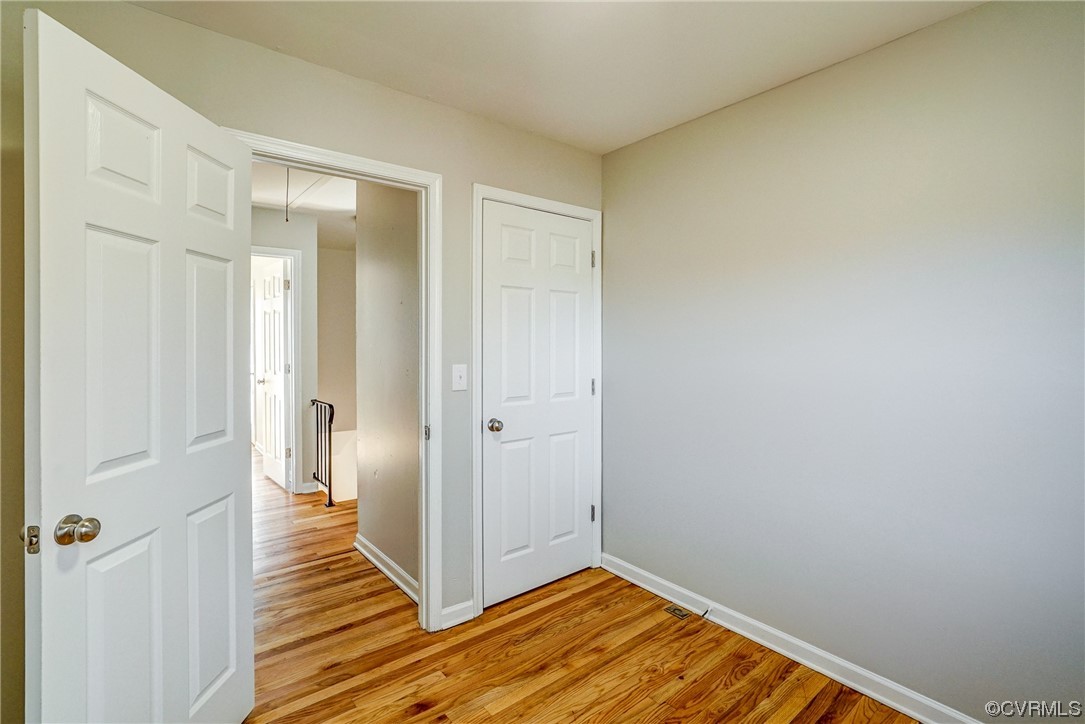 603 Bailey Road Charlottesville, VA 22903 - Photo 33 of 37 a view of a room with wooden floor and a bathroom