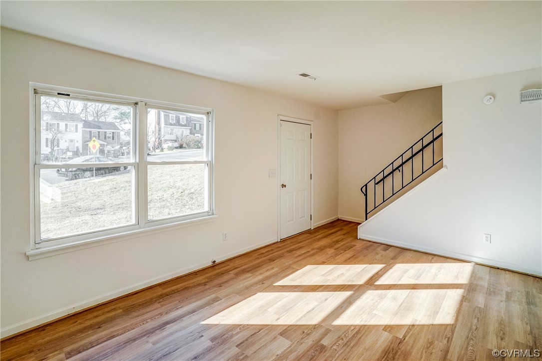 603 Bailey Road Charlottesville, VA 22903 - Photo 10 of 37 a view of an empty room with wooden floor and a window