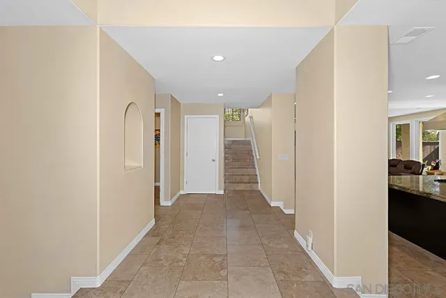 a patio with a fireplace and a table