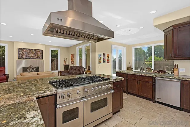 a dining room with furniture and front door