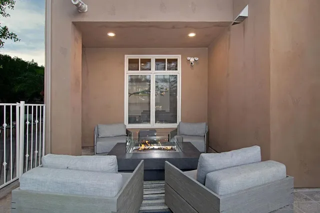 a view of a balcony with chair and table