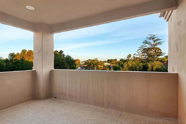 a view of a house with a plant from a window
