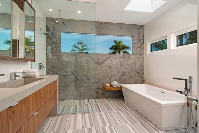 a bathroom with a granite countertop sink mirror and double