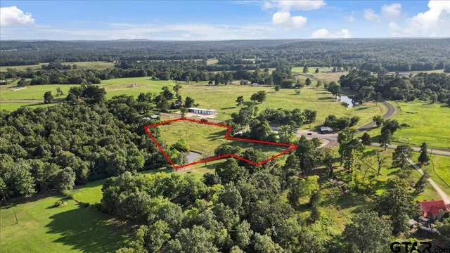 a view of a lake with houses in the back