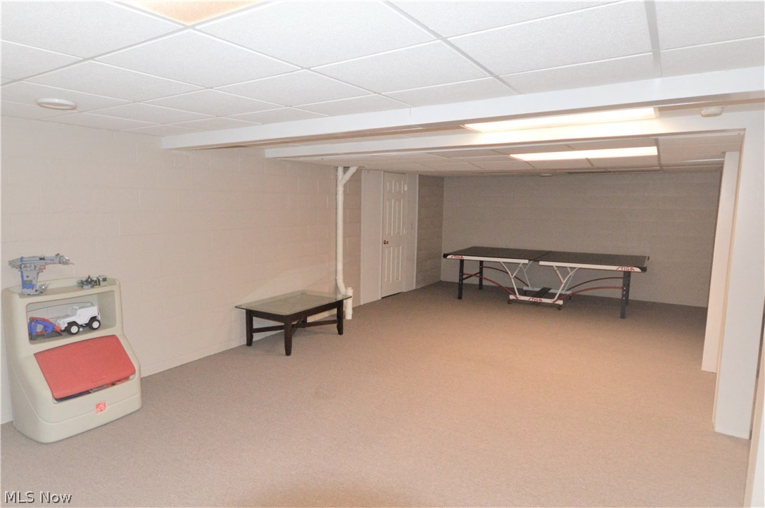 4112 Logans Way Perry, OH 44081 - Photo 25 of 29 Basement is partially finished with drop ceiling and carpet.