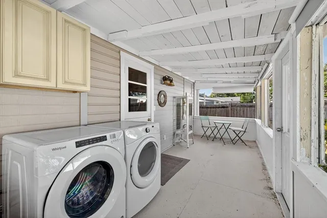 a view of a hallway with washer and dryer