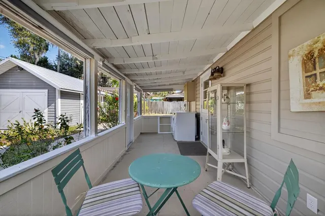 a view of a chairs and table in a patio