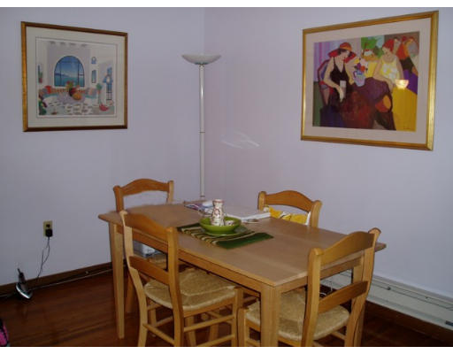 28 Parkman Street, Unit 2 Brookline, MA 02446 - Photo 3 of 8 a view of a dining room with furniture and wooden floor