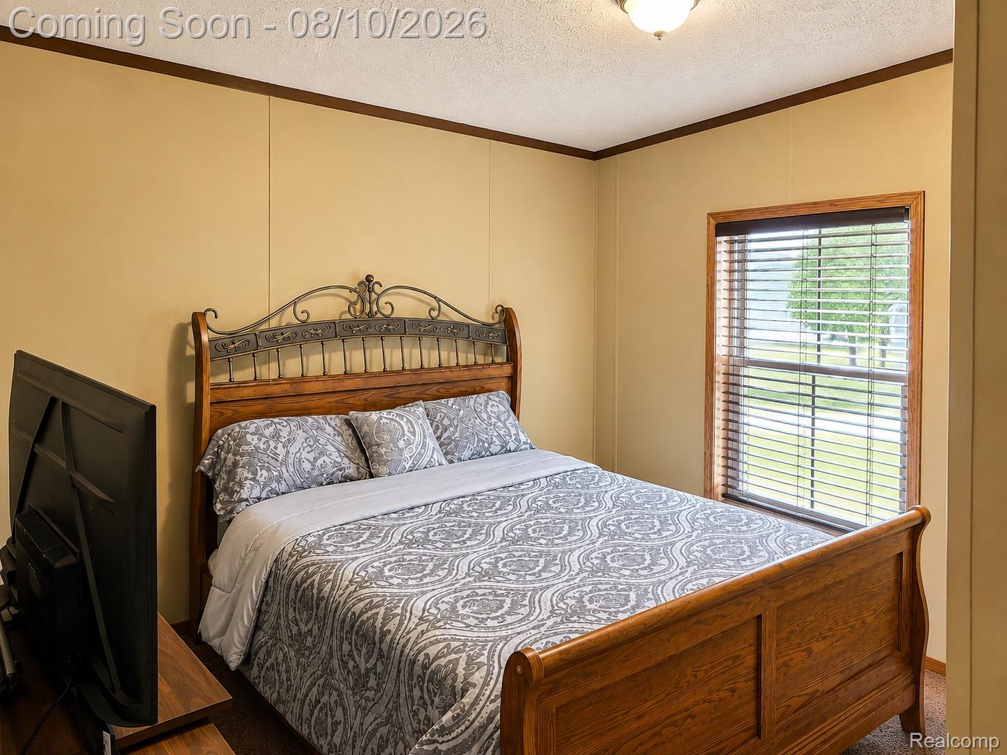 3730 Lapeer Road Port Huron, MI 48060 - Photo 16 of 18 Warm-toned wall paneling, wood-framed window with blinds, and ceiling-mounted light fixture