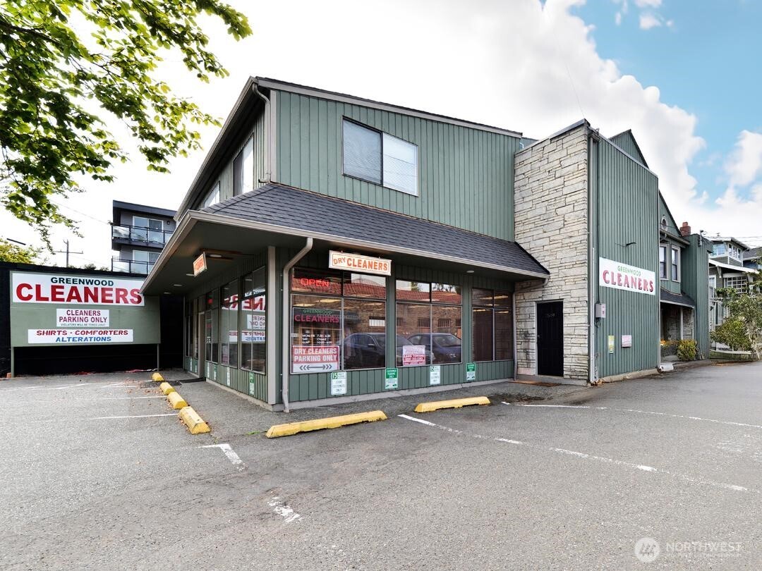7519 Greenwood Avenue North, Unit 1 Seattle, WA 98103 - Photo 1 of 13 a view of a building with sitting area