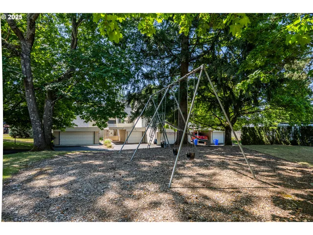 a view of a outdoor space with a house in the background