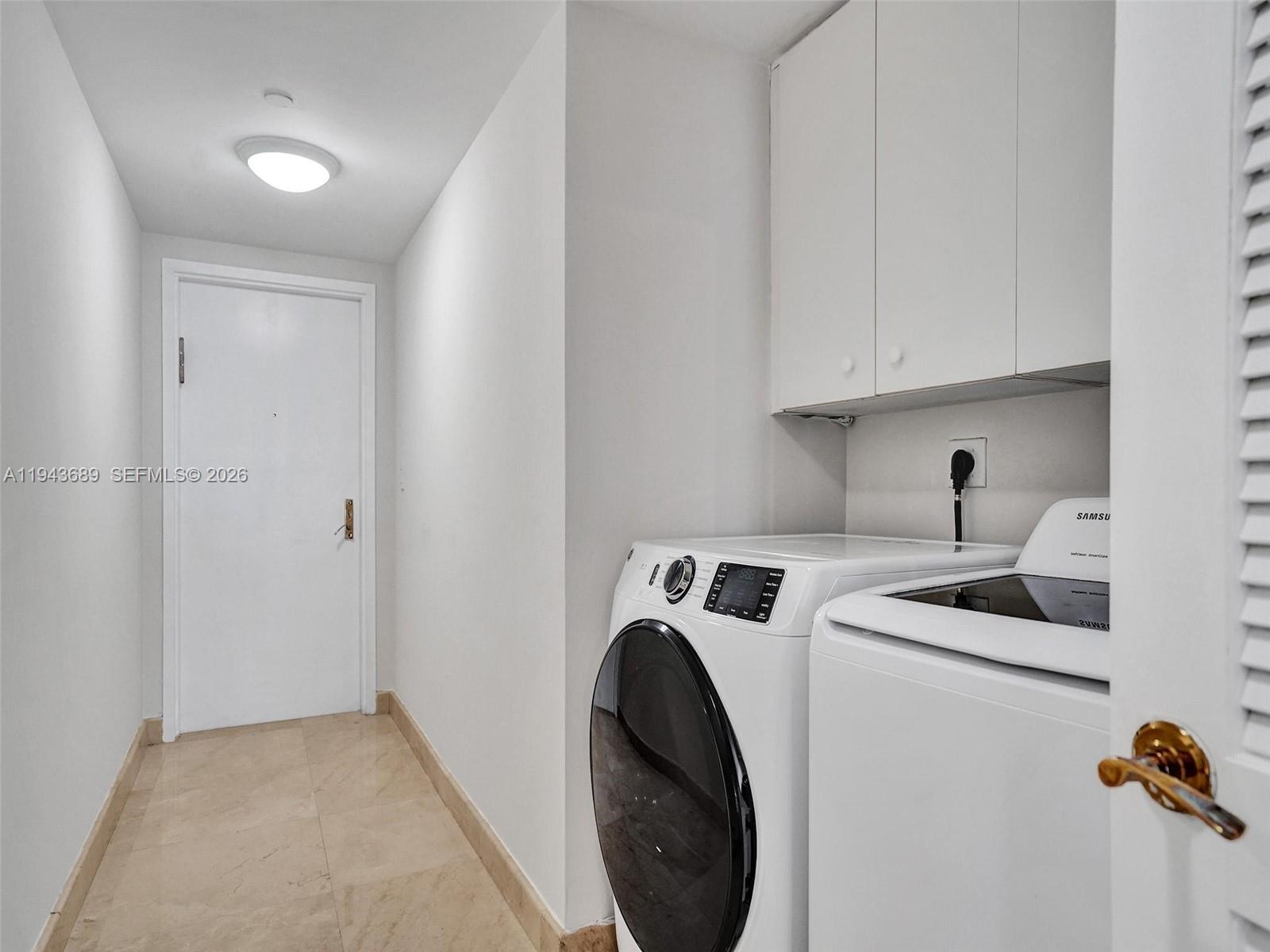 9595 Collins Avenue, Unit N8H Surfside, FL 33154 - Photo 13 of 35 a utility room with sink dryer and washer