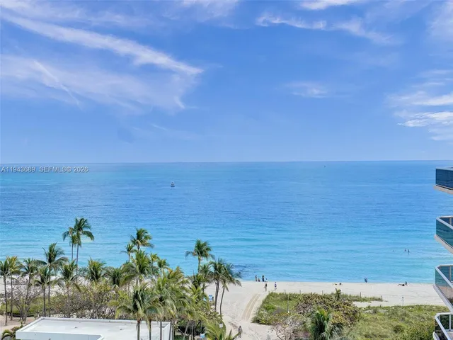a view of a yard and ocean view